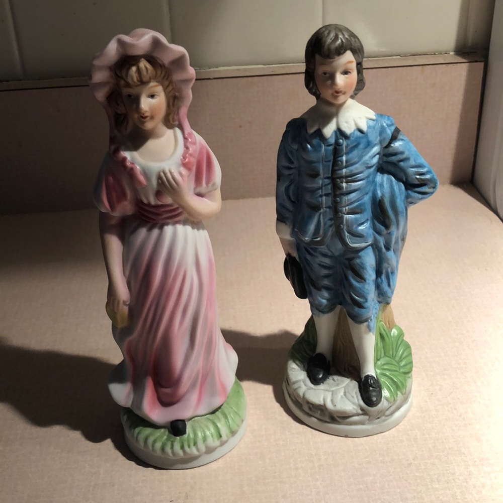 Flambro man & woman figures.  Stands 7 3/4”tall.  Flawless. No chips or cracks.